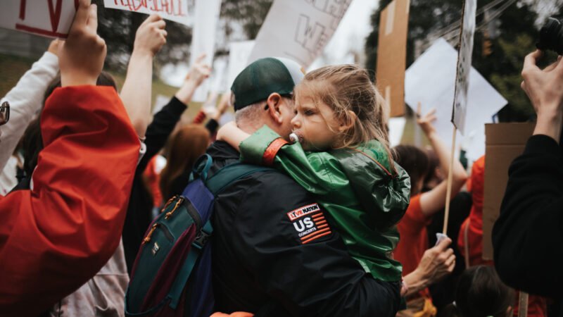 Parent holds daughter at Nashville protest