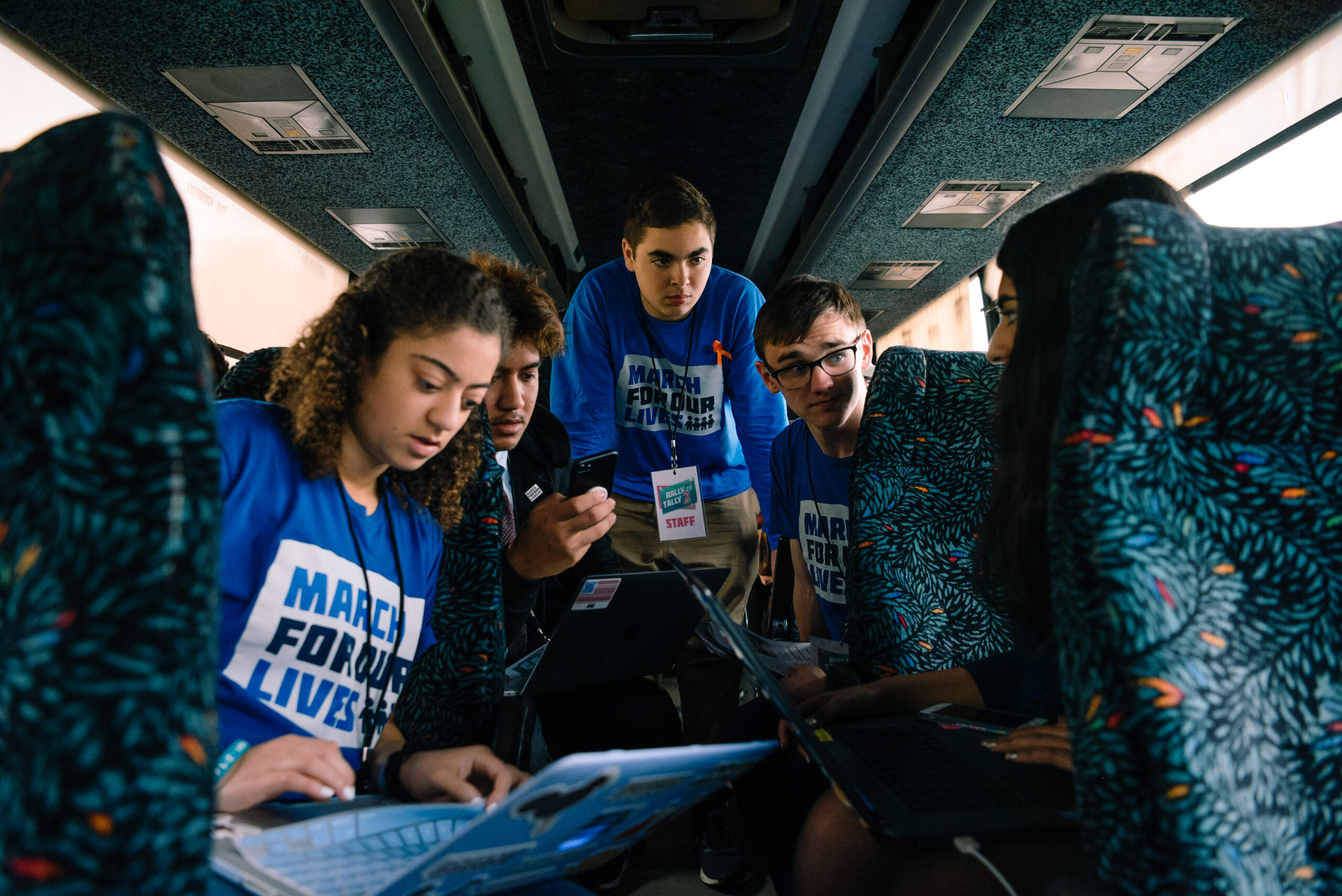 Serena Rodrigues and other MFOL members prepare for the Rally to Tally lobby day while on the bus.